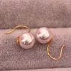 Dingle örhängen underbart par 8-9 mm sydsjön runda vit pärla örhänge 14k