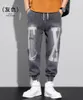 Calça Masculina Clássica Streetwear Casual Masculino Fitas Harém Jogging Letter Masculino Ajuste Justo Mola Multi-bolsos Calça Feminina T22