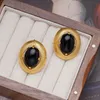 Ear Cuff Franse retro high-end gevoel metalen ovale zwarte stenen oorbellen geschikt voor damesmode licht luxe temperatuur sieraden meisje cadeau 230714