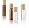Garrafas de rolo de vidro transparente fosco 5ml 10ml com rolos de metal bola frascos de óleo essencial com tampa de bambu JL1564