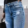 Jeans da donna Jeans da donna a vita alta con fori a strappo jeans con tasche con bottoni elastici jeans da uomo slim fit jeans da donna Push-up vestiti da strada moda Z230717