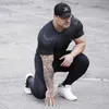 Men's T-Shirts GYM Sport Running Men T shirt Fitness Slim High Elasticity Breathable Quick Dry Bodybuilding Tight Mens Tshirt Men Tee Tops L230713