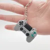 Nyckelkedja män kvinnor tecknad gamepad modell keyring pvc flexibelt lim material mode blandad färg bilväska nyckelchain charm hängande spänne smycken tillbehör