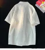Erkek sıradan gömlekler 2023 Yaz Kore tarzı büyük gömlek çizgili kısa kollu cep dekoratif bırakılmış düz renk üstü