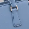 2023 High köpte butik Premium Cowhide Women's Bag with Key Silver Coin Liten Bag Deluxe Grey Blue Pink Style One Shoulder Oblique Handheld Designer Brand Style Style