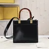 2023 Top Luxury Cowhide Women's Tote Bag Средняя двойная пластиковая ручка с одной плечо -кросс -пакетом коричневый белый черный цвет повседневной моды тренд тренд стиль бренда стиль