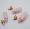 Flacon compte-gouttes en verre dépoli Pipette goutte à goutte couleur rose avec bouchon en bambou 1 oz bouteille d'huile essentielle 5 ml 10 ml 20 ml 30 ml 50 ml 100 ml caisse d'emballage JL1576