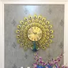 Orologi da parete Orologio di lusso Design moderno Metallo Ferro Art Forma di pavone Bellissimo per soggiorno Ristorante Decor Orologio da appendere