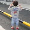 Set di abbigliamento Tuta estiva per ragazzi 2023 Bambini Streetwear T-shirt a maniche corte per ragazzo Pantaloncini Set sportivo in due pezzi Completi larghi per bambini 230714