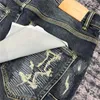 Jeans da uomo viola tendenza pantaloni firmati di marca strappati dritti regolari larghi lavati vecchio buco lungo stack Rvmn ZM10
