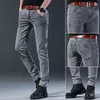 Męskie dżinsowe ubrania Mężczyźni Mężczyźni jesienne koreańsko elastyczne elastyczne rozciąganie ciasne dopasowanie wszechstronne młodzież szczupłe męskie spodnie spodnie 230715