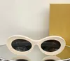 Occhiali da sole ovali Lenti grigio scuro avorio per donna Occhiali da sole estivi gafas de sol Sonnenbrille UV400 Eye Wear con scatola