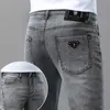 Jeans de grife Hots Jeans cinza esfumaçado masculino primavera e verão marca de moda fina Estilo europeu ajuste fino Calças justas para lazer juvenil