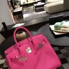 Platinum Luxurys Leather Handbag Rose Red Bag 2024 Fashion Versatile Togo Litchi Pattern Bridal Bag