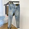 Jeans masculinos designer quente mens jeans monstro olhos para homens fino ajuste tubo reto strettrendy calças casuais g66o