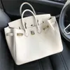 Platinum Luxurys Leather Handbag Bag Womens Bag Togo Top Layer Lychee Grain Calfskin Lock Bridal Bag