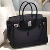 Platinum Luxurys Leather Handbag Bag Womens Bag Togo Top Layer Lychee Grain Calfskin Lock Bridal Bag