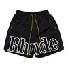 Designer Rhude Shorts Summer Fashion Beach Kort ärmar Skjortor Casual T Shirt Rhude Tees Blue Black Mesh Shorts Tops Tracksuit Pants