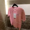 Roupas femininas Camisetas de grife redondas ocas Pulôver de manga curta Tricô Camiseta com estampa de letras Moda Roupas de 4 cores