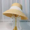 Chapeaux à large bord forme de lampe femmes été grand chapeau de paille disquette noir blanc ruban dentelle cravate soleil Anti-UV plage casquettes Cape