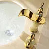 Badrumsvaskar kranar europeiska klassisk imitation marmor dubbel den tre håls naturliga jade guldpläterade och kalla vattenfallet bassängtappar