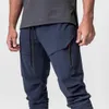 Pantalons décontractés solides hommes Joggers Gym Fitness pantalons de survêtement minces course à pied pantalons à séchage rapide hommes vêtements de sport d'entraînement