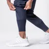 Pantalons décontractés solides hommes Joggers Gym Fitness pantalons de survêtement minces course à pied pantalons à séchage rapide hommes vêtements de sport d'entraînement