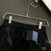 Shorts soltos de carga casual de metal com vários bolsos para homens de verão, shorts esportivos de tendência solta, todos os bolsos são práticos e convenientes, vento de carga esportiva.