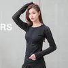 Camicie attive Top sportivi scava fuori Maglia da donna Slim Fit Mesh Yoga Fitness T-shirt Maglie da allenamento in palestra solide e flessibili a maniche lunghe