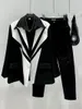 女性のスーツスーパーエーンブレザー女性2023スタイルのニッチ分解黒と白の色コントラストルーズコート