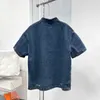 Veste de chemise à manches courtes en denim à revers bleu d'été, trou en denim décontracté, version ample des hommes et des femmes de la même chose.