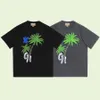 23SS nya kvinnliga mäns solida t-shirts high end begränsad klassisk handmålad kokosnöt trädtryck tee sommar strand andas anda mode gata kort ärm tjammtx346