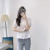 Kvinnor BLOUSES Spring Autumn Style Wild White Shirt Chic Design Oregelbundna Slim Women Korean Single Breasted Blaus Short Femnina Top