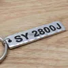 Bilnyckel Anpassad Antilost Keyring Car Number Plate Key Chain Bar Keychain Graverad nummer Nyckelringsmycken Ny drivrutin Gift till pappa X0718