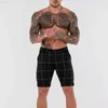 Shorts masculinos Shorts masculinos com design de botão de moda 2023 Verão novo estilo britânico Shorts finos casuais esportivos Calças de 5 pontas Cinza Joelho L230719