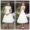 Vintage z lat 50. krótkie koronkowe suknie ślubne pół rękawów Tiul Lace Applique Długość herbaty ślubne suknie ślubne z guzikami C265Y