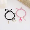 Pulseira Qiluxy 2pcs conjunto Nice Cartoon Pair Magnet Ball Hand Homens e Mulheres Poison Friendship Charms Elastic Touch Jewelry235C