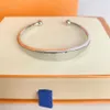 Designer smycken Bangle Rose Gold Silver Silver Rostfritt stål G CD F TB Cross Pattern Buckle Love SMycken Kvinnor Mensarmband Märke CA295E