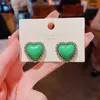 Pendientes de tuerca con temperamento mágico en U, pendientes de corazón de amor verde para mujer, joyería de boda de Metal de Color plateado en espiral a la moda