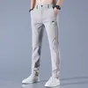 Pantalons pour hommes 2023 printemps été Golf balle brodée haute qualité élastique mode décontracté respirant 230720