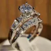 Pierścienie ślubne błyszczące 2pcs Zestaw białego kamiennego cyrkonu Zestaw zaręczynowy dla kobiet srebrny kolor vintage biżuteria ślubna prezent B4N967313R