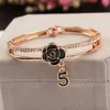 Brazalete de Camelia esmaltado negro coreano para mujer, pulsera con dijes de 5 letras de cristal brillante, joyería de boda de marca de moda Z093 L230704