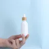 白い磁器E液体試薬ピペットドロッパーボトル丸いエッセンシャルオイル香水ボトル木製の竹のふたが付いていますtqsmi