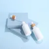 白い磁器E液体試薬ピペットドロッパーボトル丸いエッセンシャルオイル香水ボトル木製の竹のふたが付いていますtqsmi