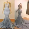 Luksusowe srebrne cekinowe sukienki na bal matrowe koronkowe aplikacje seksowne iluzoryczne suknie wieczorowe kantarki