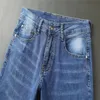 Luksusowe dżinsowe projektanty męskie spodnie Błękitne Rozmiar 28-40 Casual Summer Thin Pants Design Khaki Grid Grey Pant Najnowsze listę bawełny fash314r