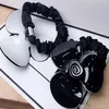 6 5CM black and white Acrylic hair ring Camellia rubber bands head rope for Ladys collection Fashion classic Items Jewelry headdre253Y