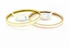 Goedkope sieraden met gegraveerde 18K gouden titanium stalen damesarmband uit de Tan-familie met echt logo