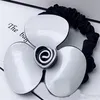 6 5CM black and white Acrylic hair ring Camellia rubber bands head rope for Ladys collection Fashion classic Items Jewelry headdre315v