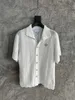 A mais recente camisa de designer de verão moda onda textura material de tricô camisa tamanho dos EUA camisa de marca de luxo masculina casual camisa de manga curta
